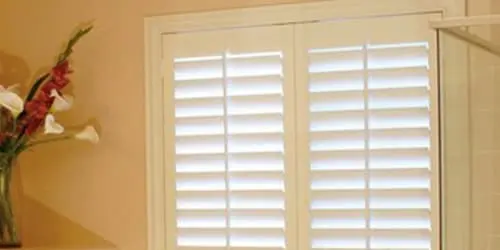 Living Room White poly plantation shutters