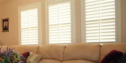 Living Room White poly plantation shutters